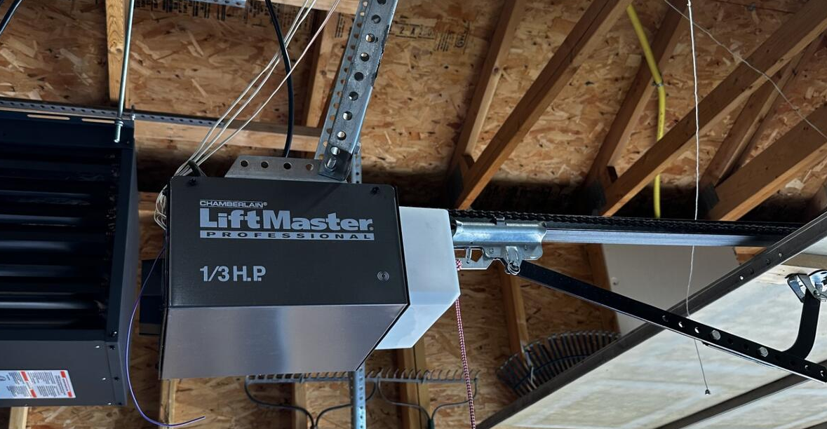 Technician performing a professional garage door opener installation for a residential home in Clintonville