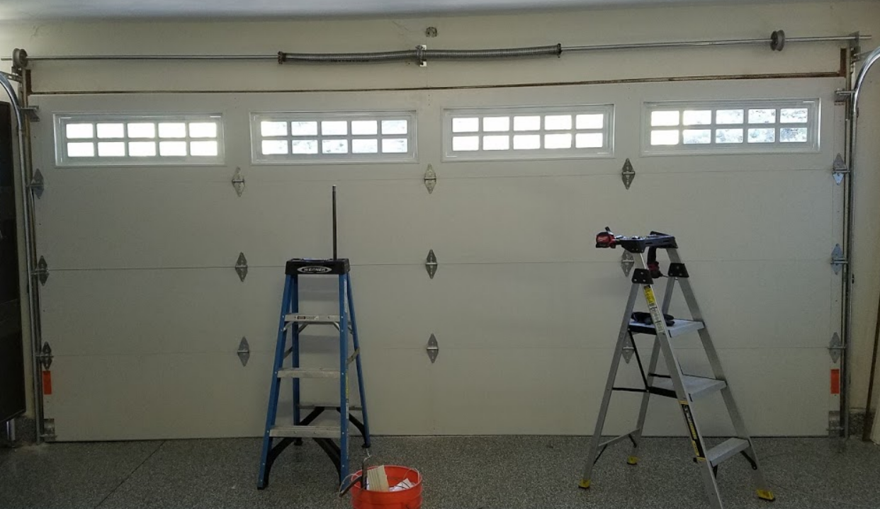 Professional garage door repair services in Clintonville - Expert technicians fixing and maintaining residential garage doors for safety and efficiency.