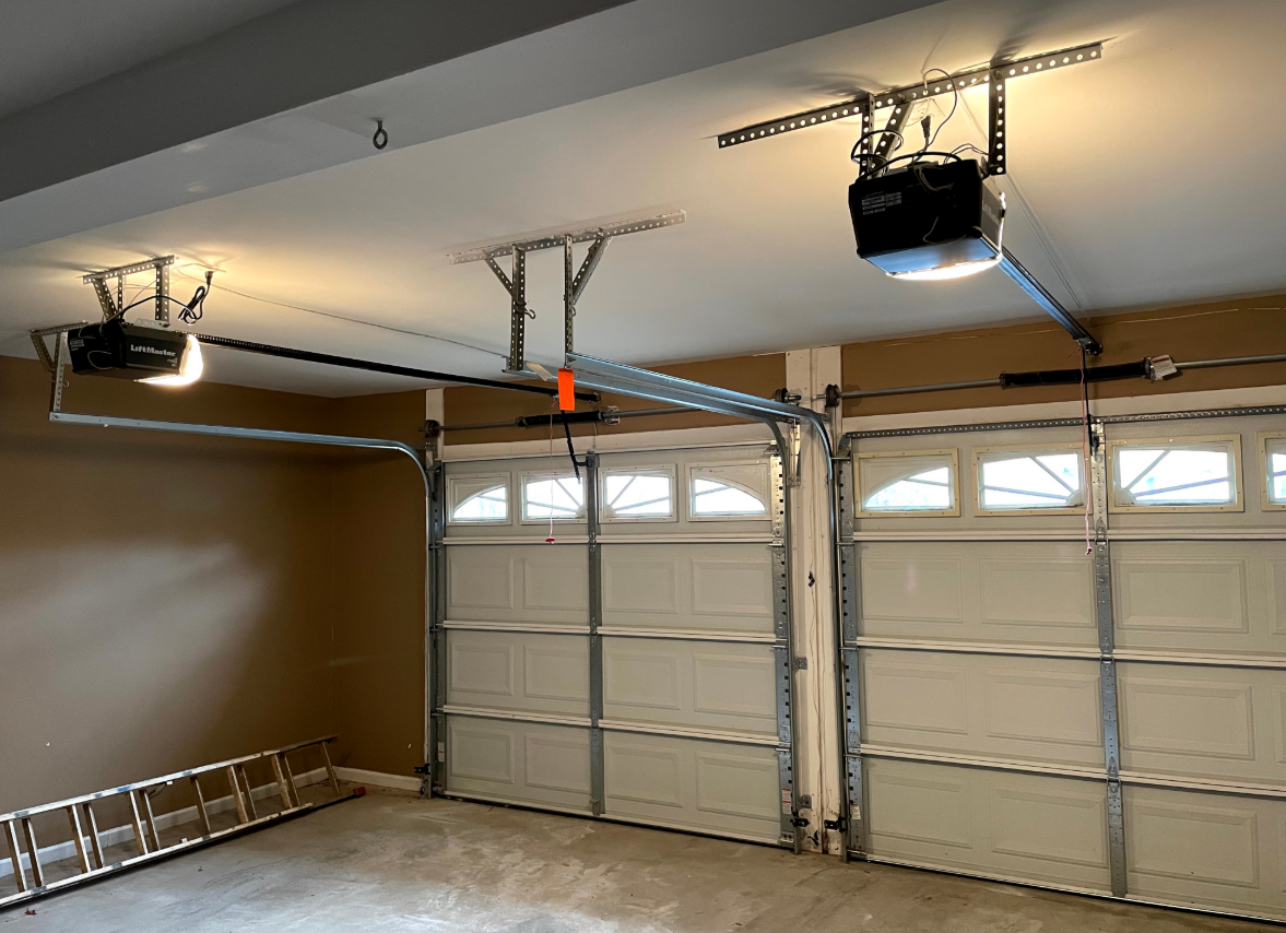 Clintonville Garage Door Repair technician fixing a residential garage door, ensuring smooth operation and safety.