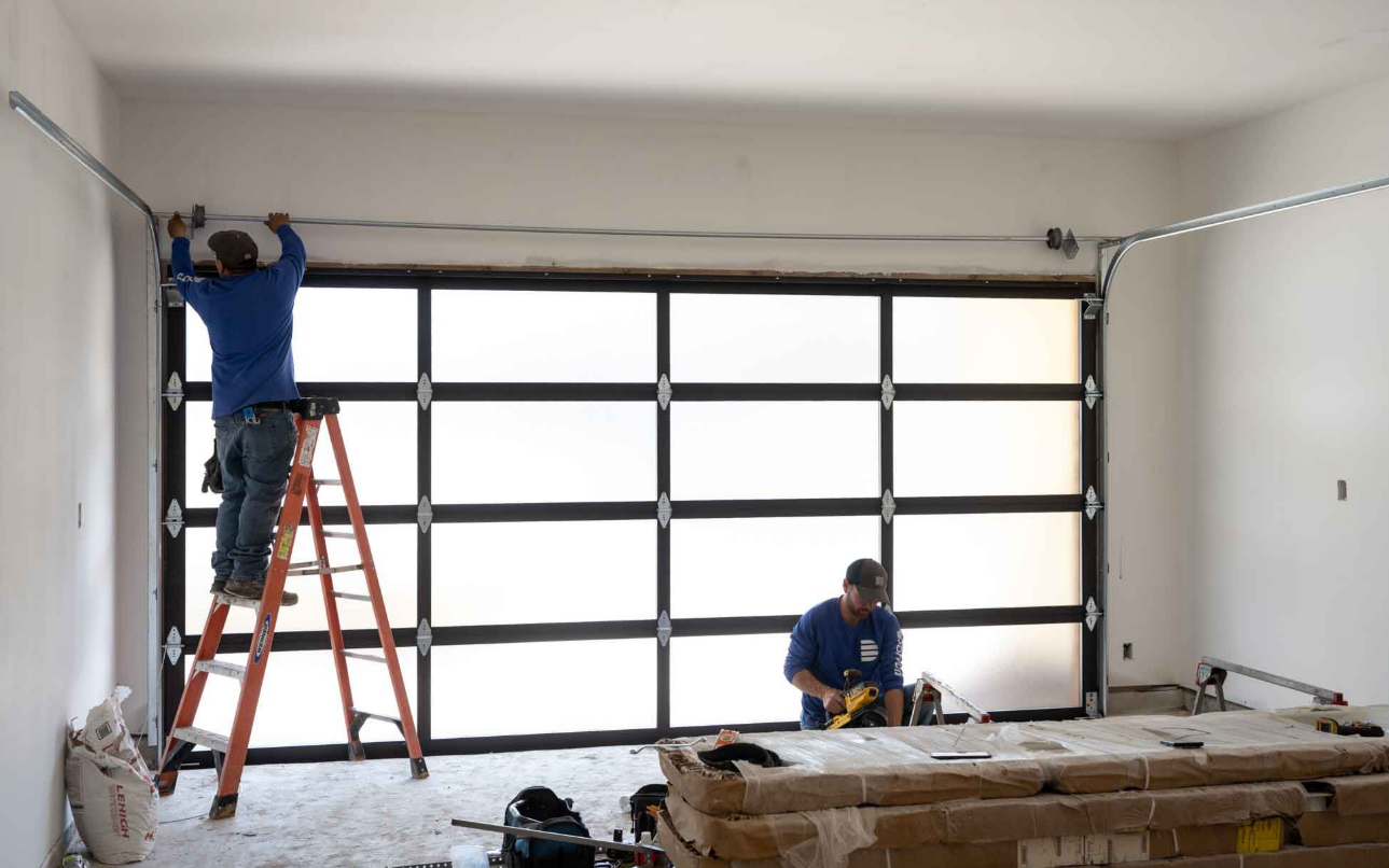 Technician performing garage door repair in Clintonville - Clintonville Garage Door Repair LLC specializes in expert garage door maintenance and service.